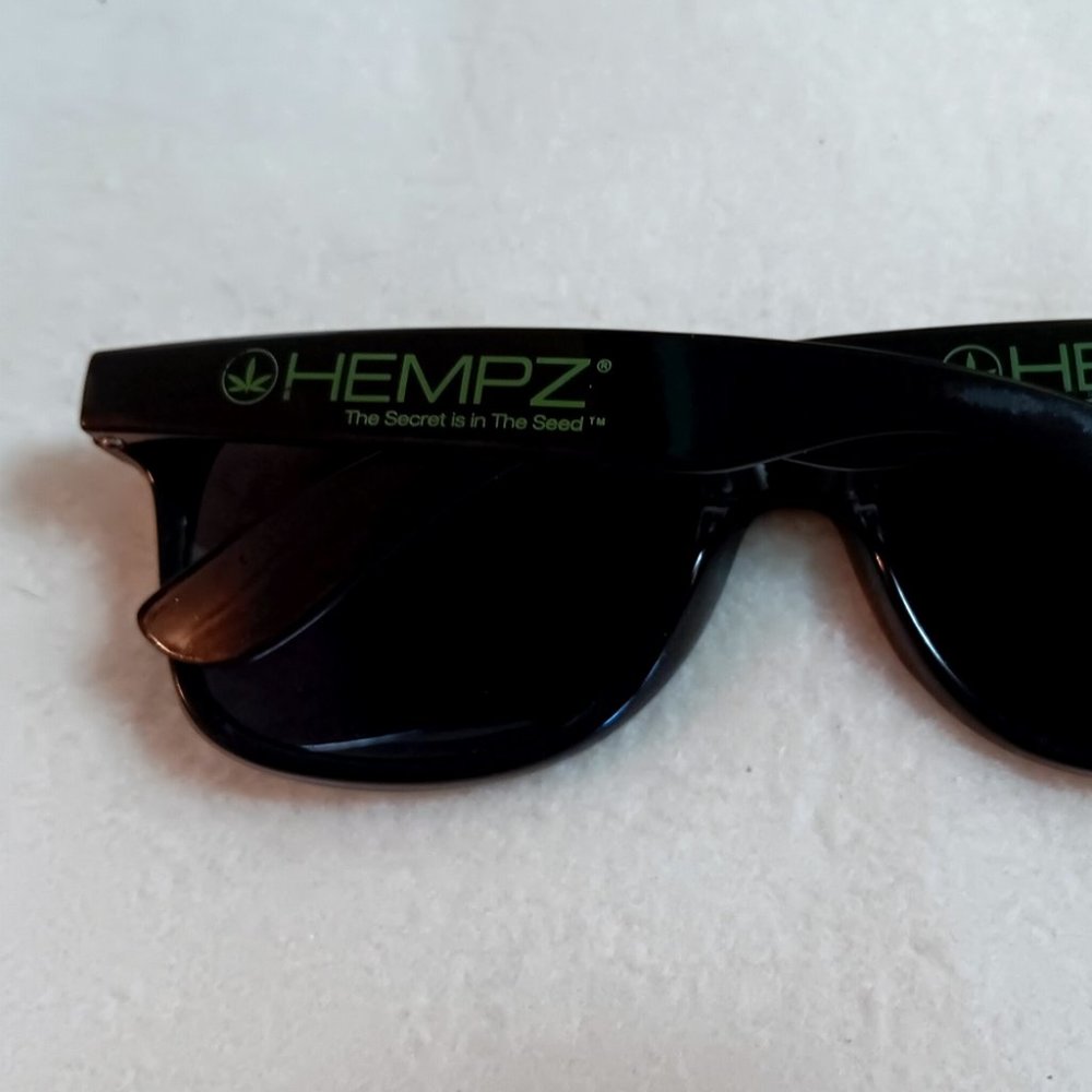 Hempz advertising sunglasses black w/ green lettering